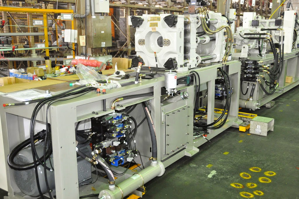 Engineer working on an injection moulding machine